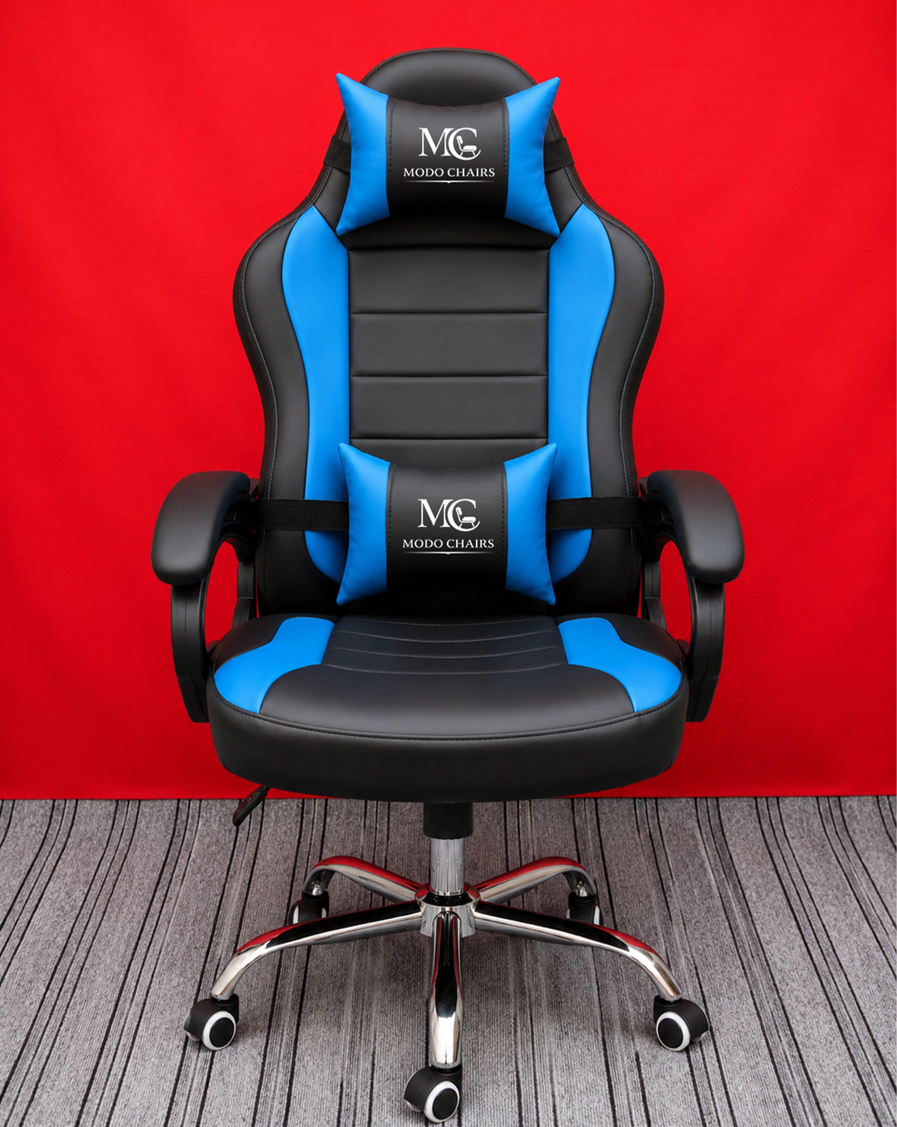 Blue Modo Phantom X gaming chair with ergonomic design, adjustable armrests, and cushioned seat for comfortable gaming sessions.